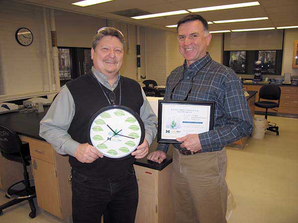 Biochemistry lab group with sustainable lab certificate